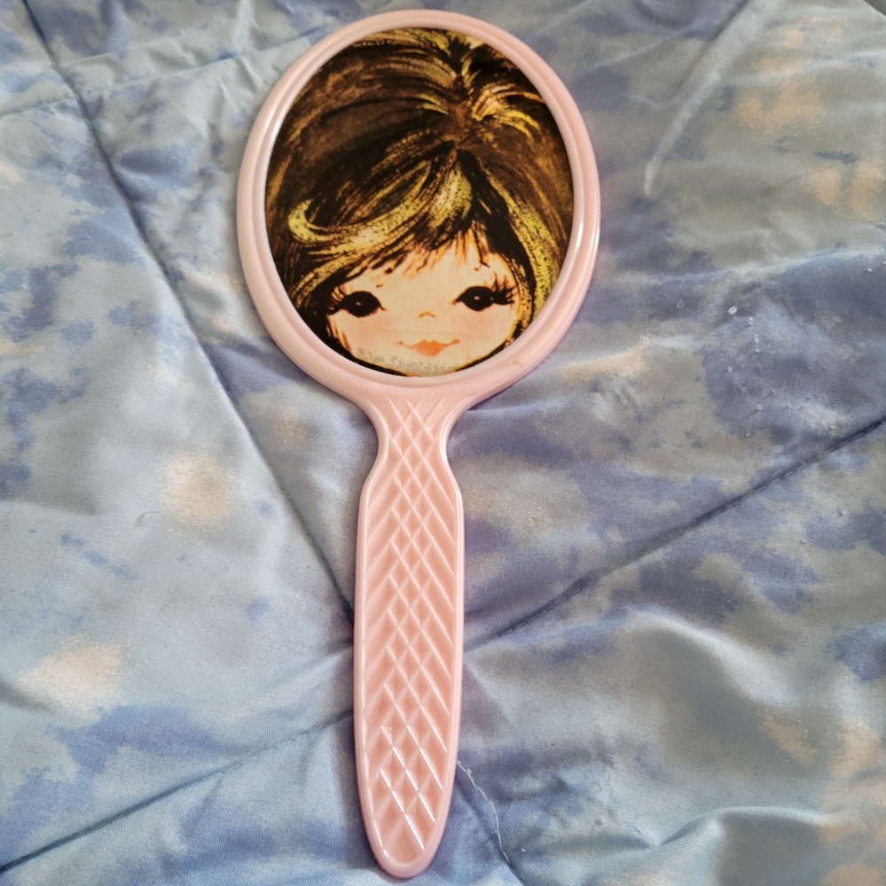 Hand held mirror
